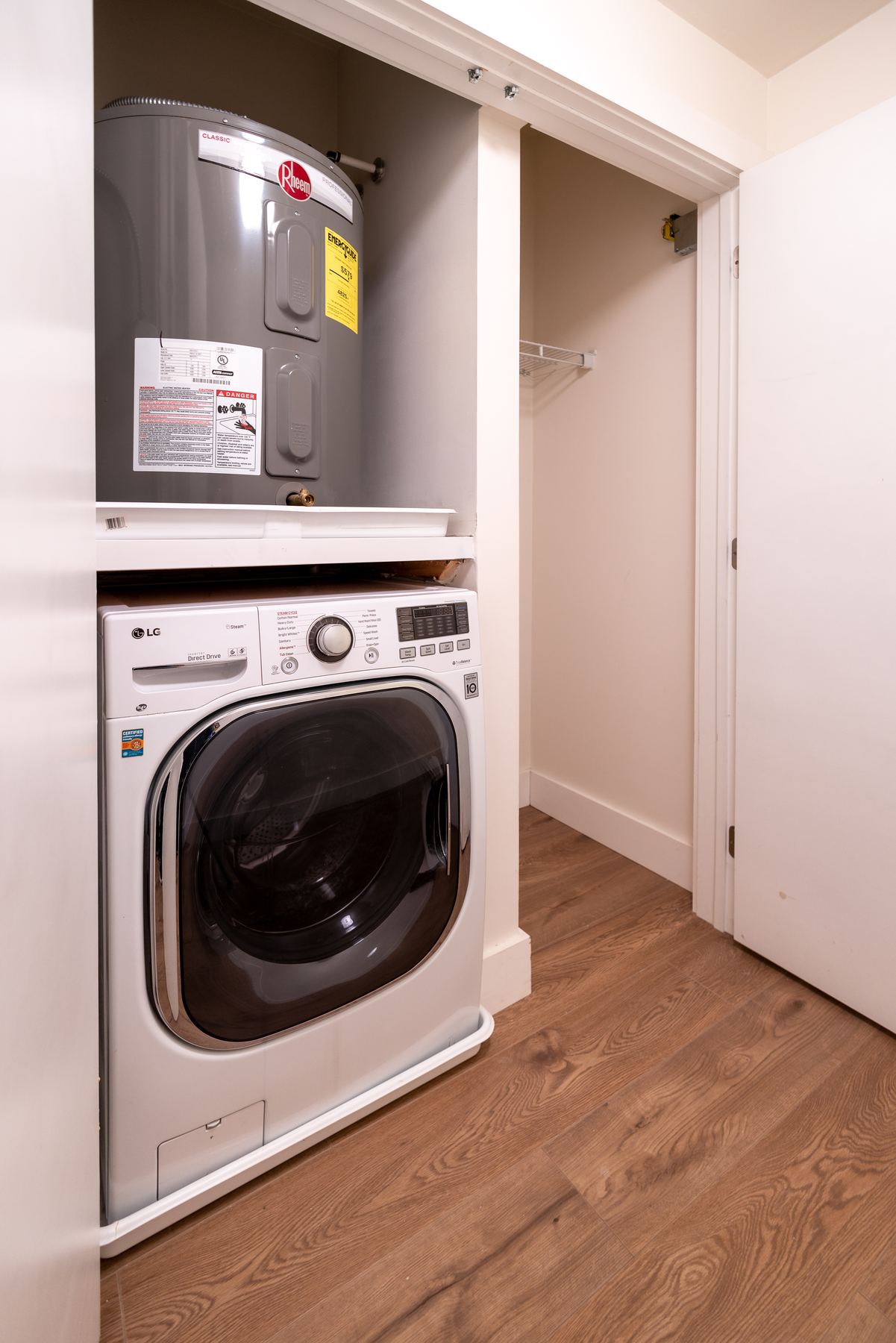 Galley kitchen with stainless refrigerator and range