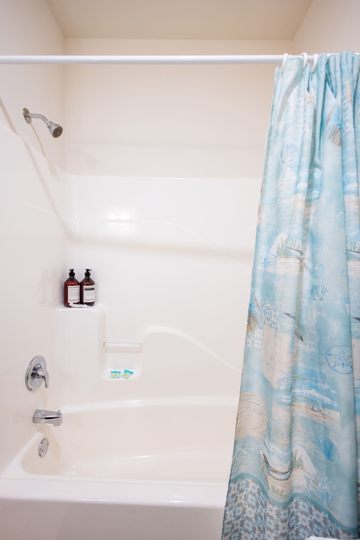 Deep soaking tub with shower