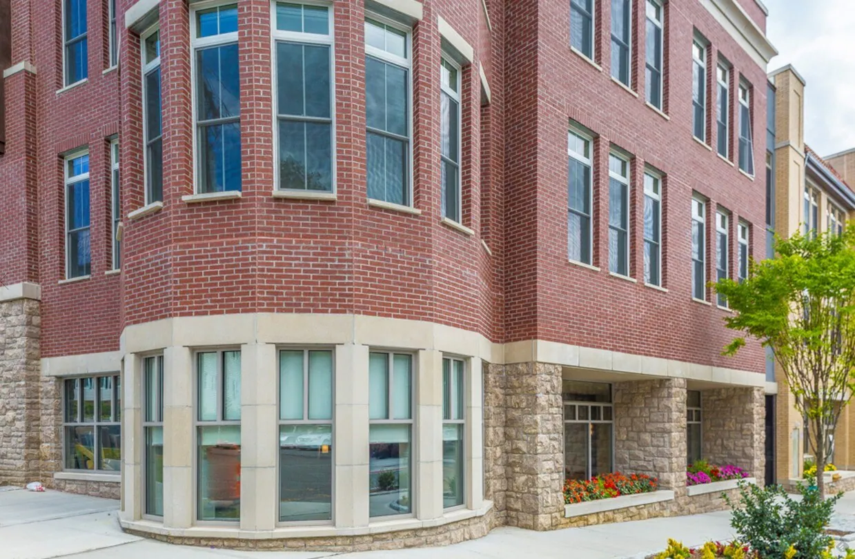 Brick and cast-stone corner facade of The Avenue at Crestwood
