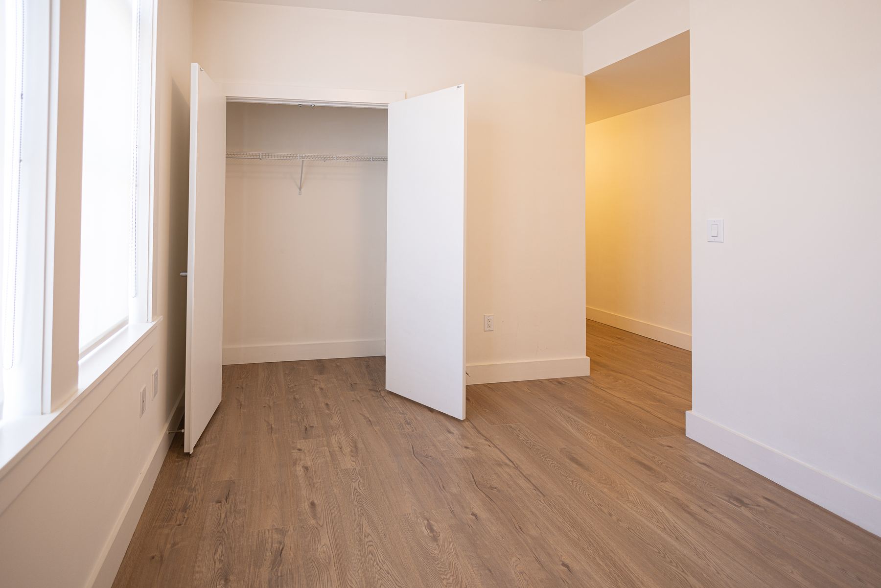 Open living and dining area with kitchen beyond