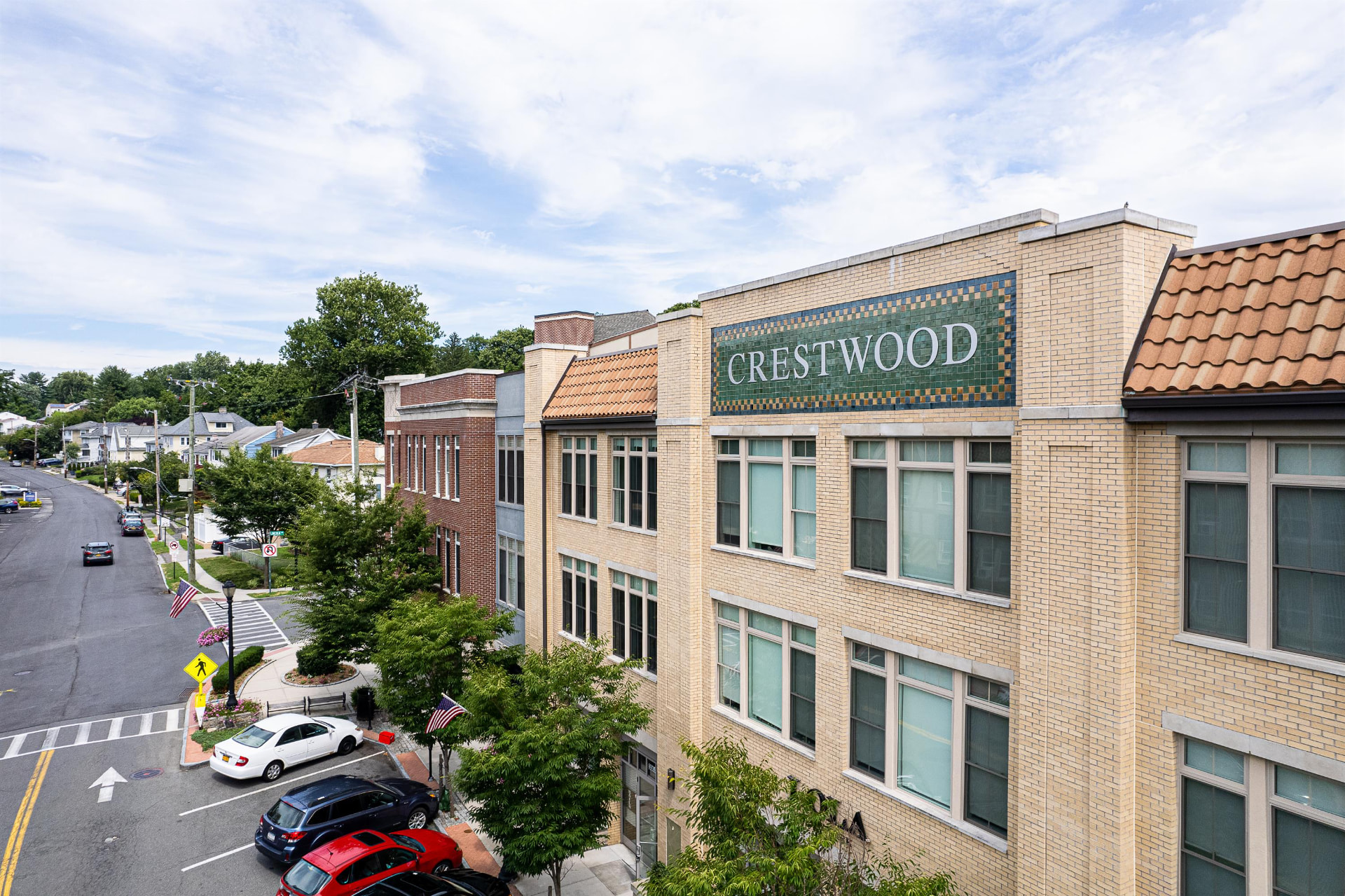 Historic tiled Crestwood sign on the neighboring village building