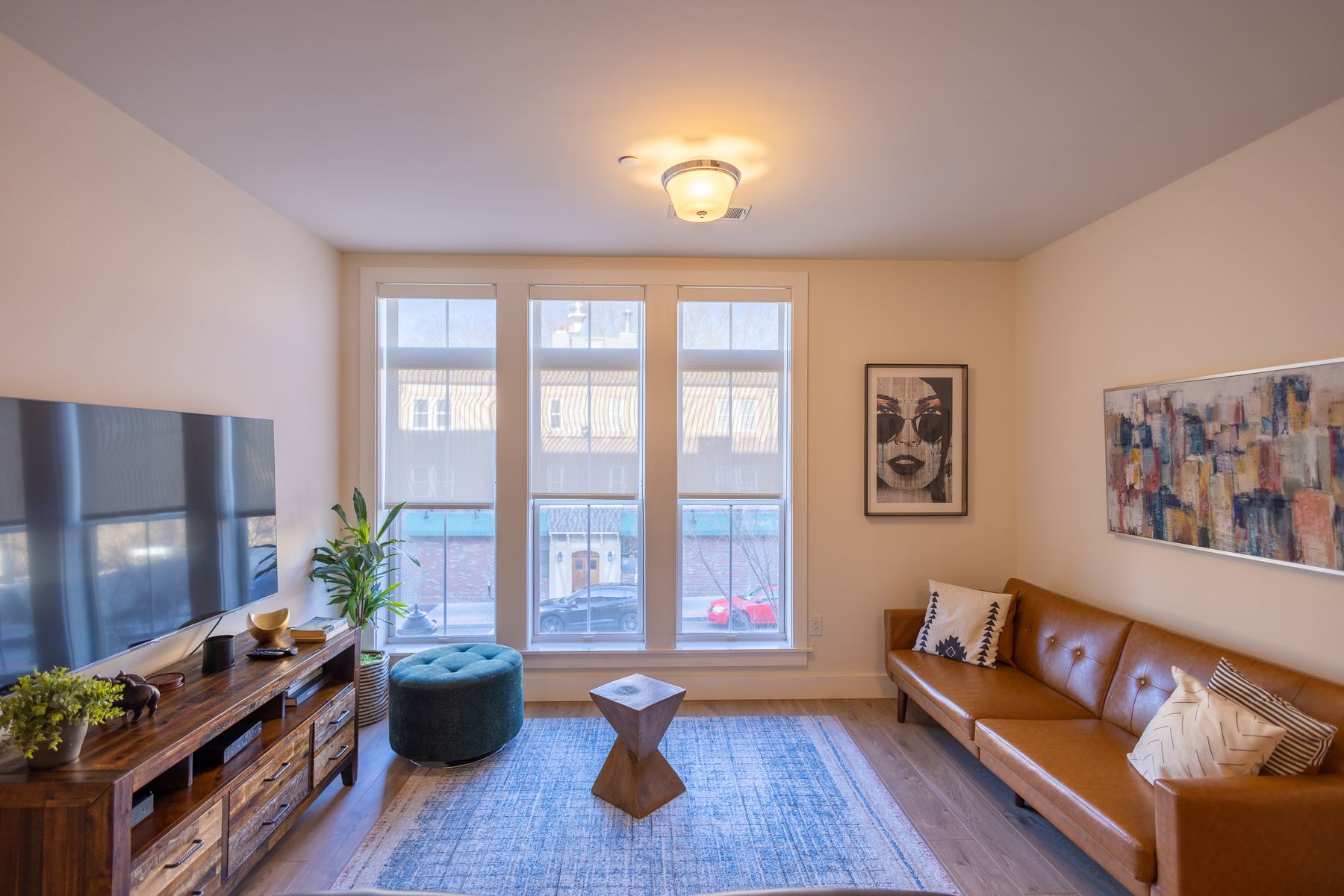 Open studio living space with tall windows