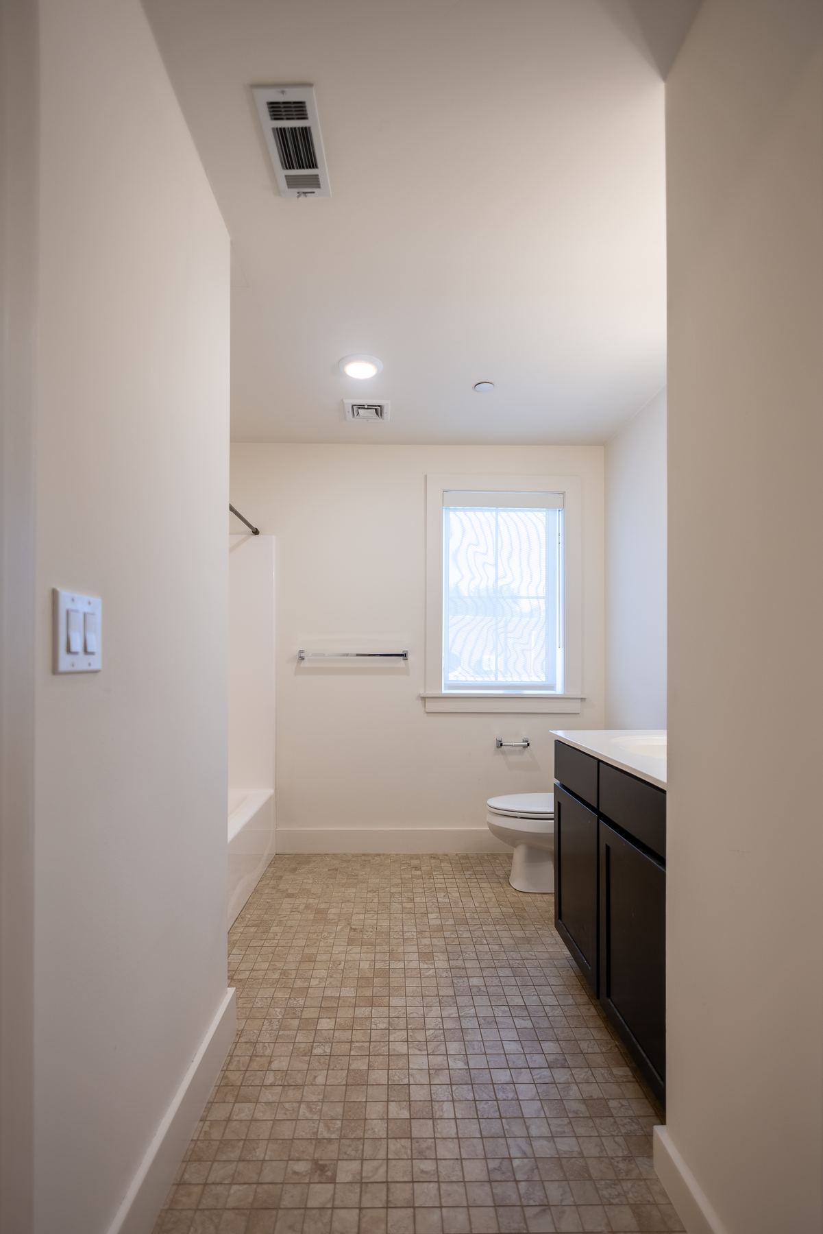 Empty bedroom with closet and window